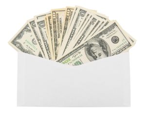 Money in an envelope. On a white background.