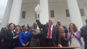 GOVERNOR MCAULIFFE GRANTS RIGHTS OF 206,000 FELONS