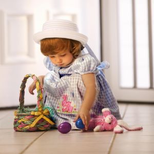 Toddler with Easter eggs and basket