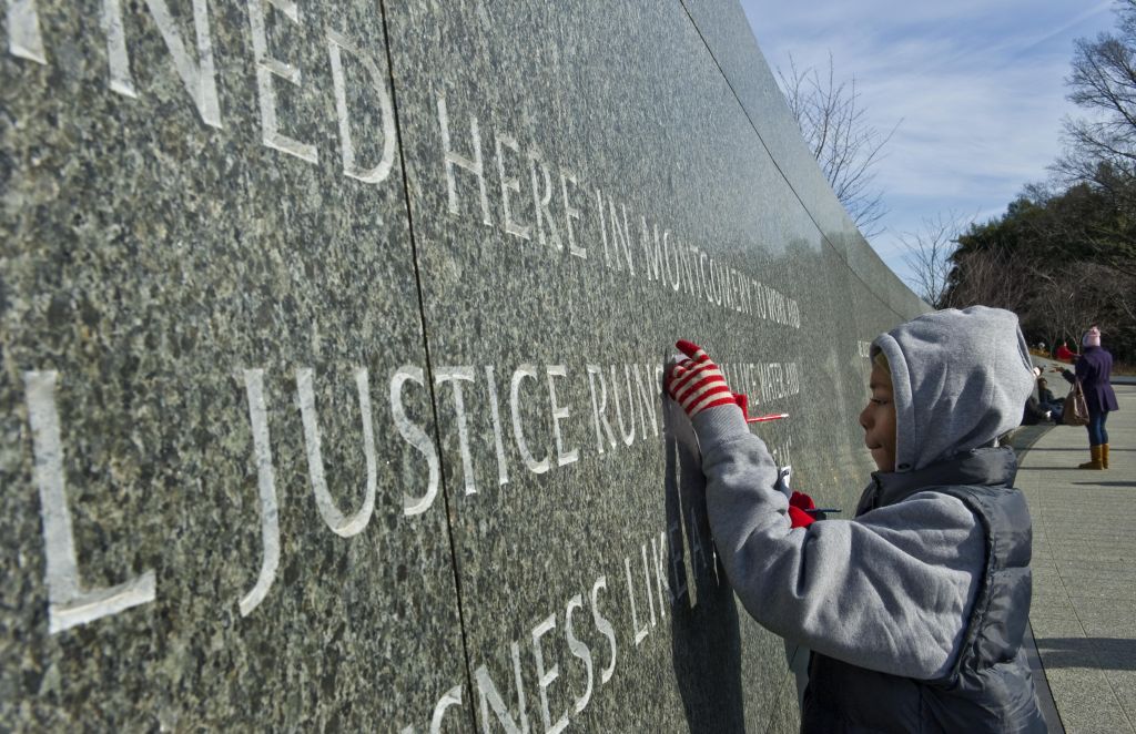 Folks gather at the Martin Luther King, Jr. memorial, open for the first time on MLK Day