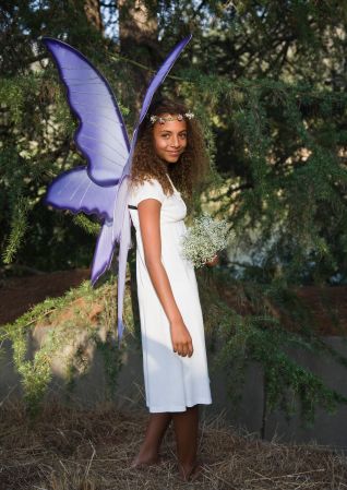 Smiling girl in fairy costume