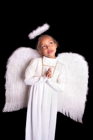 Small girl just as Angel with hands praying