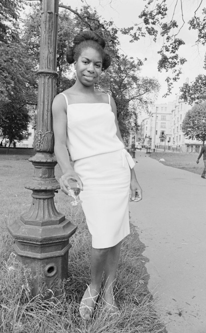 Singer Nina Simone stands besides a lampost in Hyde Park before a press reception held at Philips record company buildin
