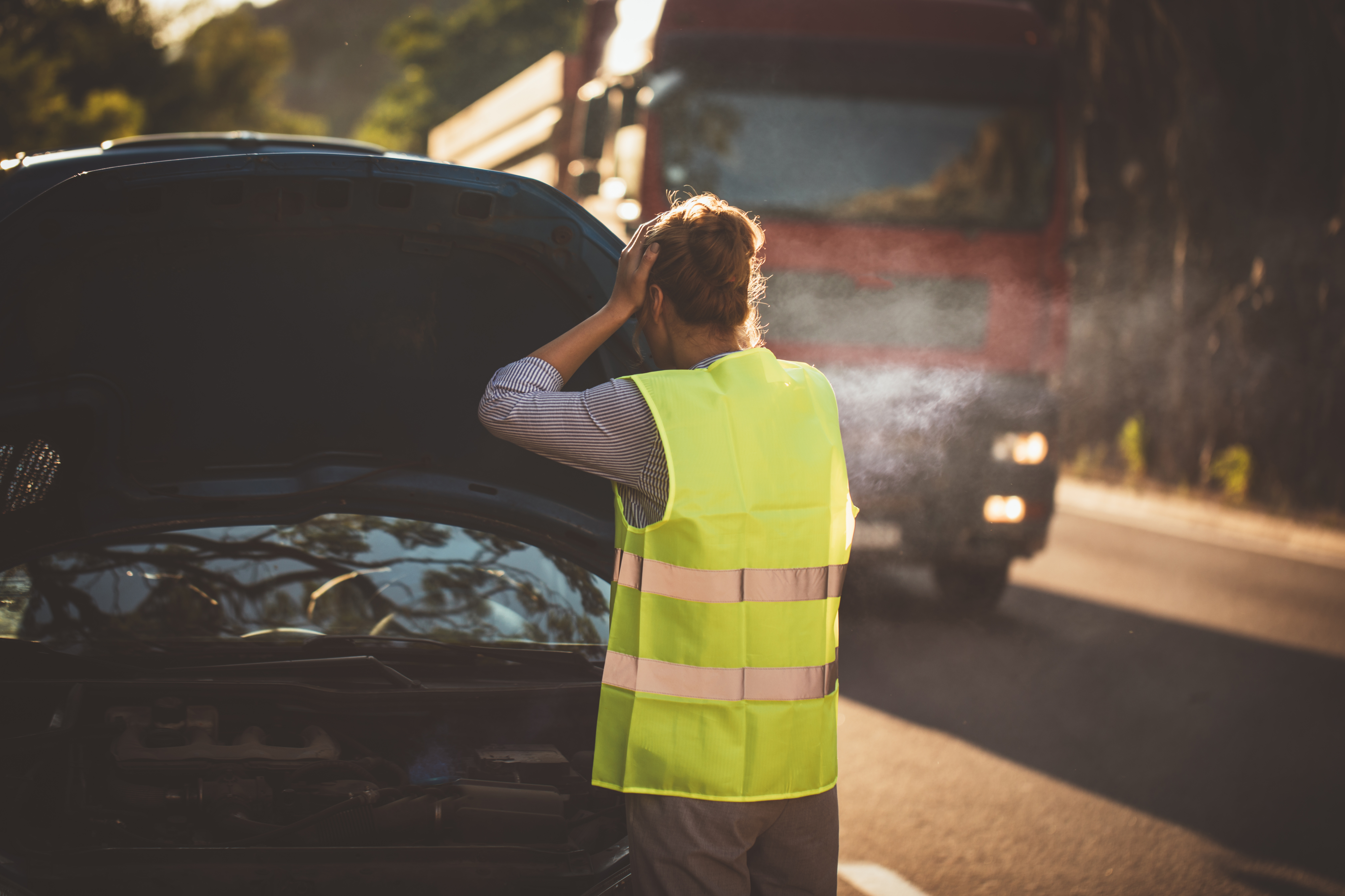 Woman tries to fix the car