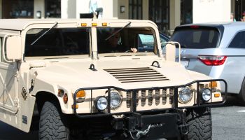 Arnold Schwarzenegger and Ralf Moeller are leaving Le Pain Quotidien cafe at the Brentwood with his Hummer H1