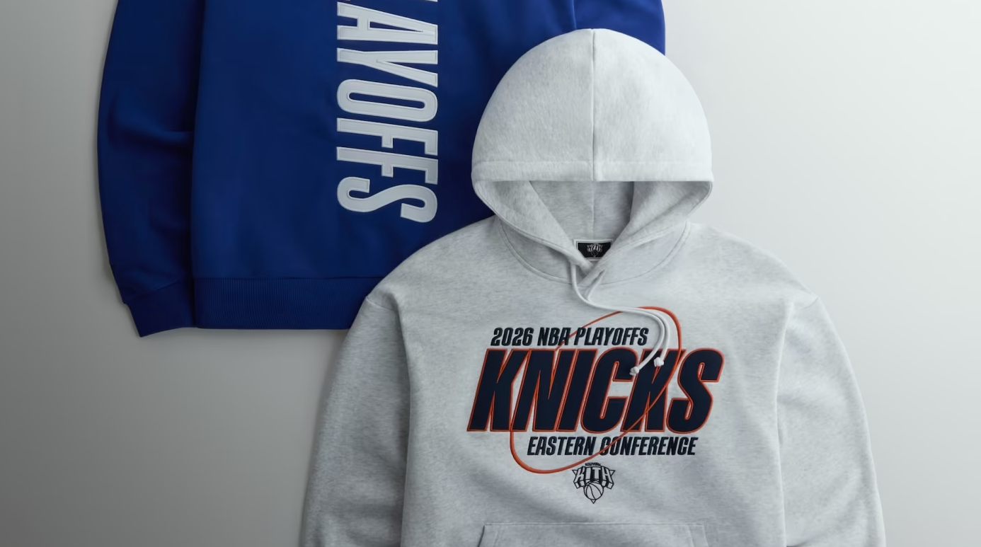 Gray hooded sweatshirt with "2026 NBA PLAYOFFS KNICKS EASTERN CONFERENCE" text, next to a blue Knicks jersey.