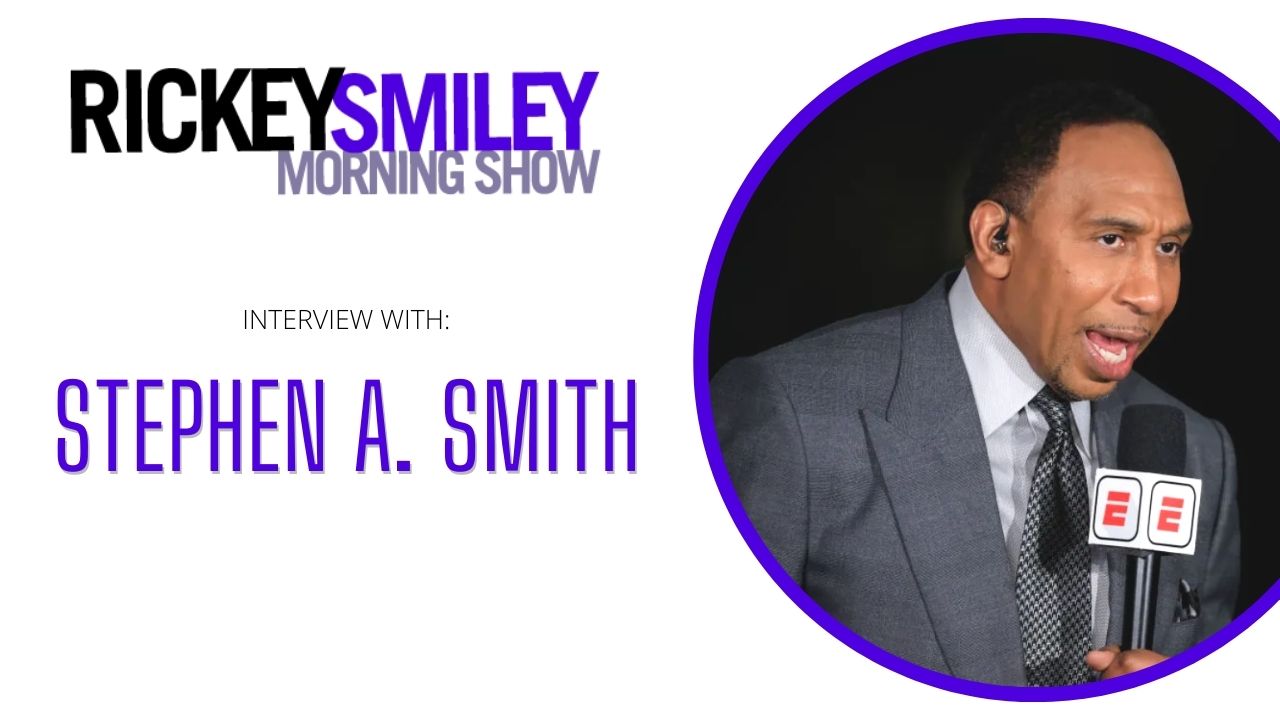 A man wearing a gray suit and tie is speaking into a microphone, with the text "RICKEY SMILEY MORNING SHOW" and "INTERVIEW WITH: STEPHEN A. SMITH" displayed above him.