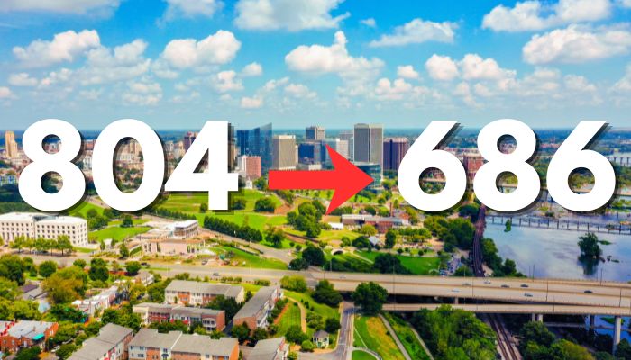Aerial view of a city skyline with the numbers "804" and "686" displayed prominently. A red arrow points to the right.