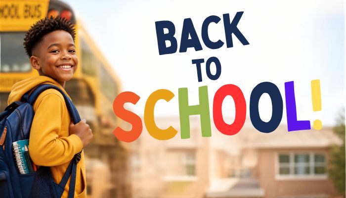 A smiling young student wearing a yellow jacket and backpack standing in front of a school bus with the text "Back to School!" displayed.